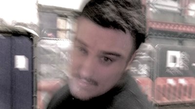 A blurred headshot of Joel Yarwood