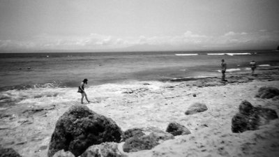 A black and white image of a beach