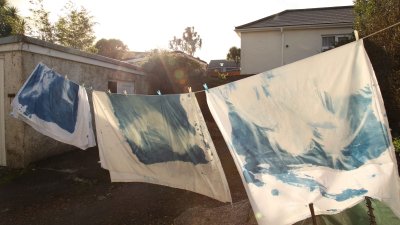 An external image of painted cloth on a washing line