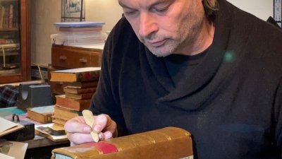 Bookbinder Tom O'Reilly doing Bookbinding
