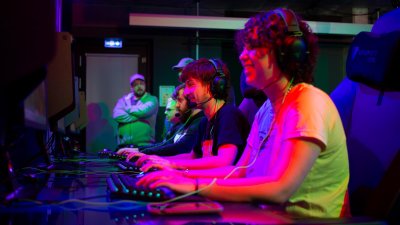 Falmouth University Esports students working at computers in an Esports studio