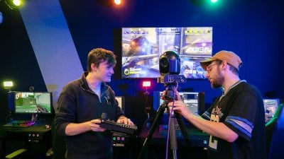 two students working at an esports camera