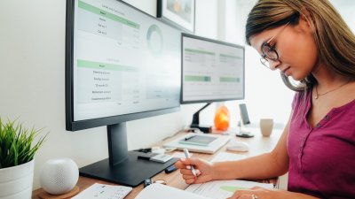 Person sat at a computer looking at data