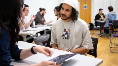 A student taking part in a portfolio review at the Falmouth University Games Expo