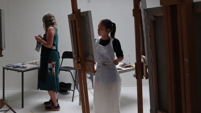 People painting from easels
