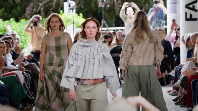 Three models on the runway at Falmouth University Graduate Fashion Show 2025