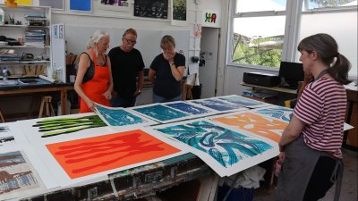 People looking at large scale screenprints