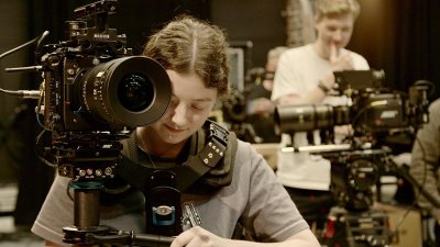 A female student operating an ARRI camera at Falmouth University