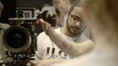 Students using an ARRI video camera 
