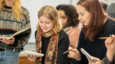 Students painting in a workshop at Falmouth Illustration Festival 