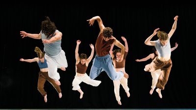 Group of dancers jumping mid air
