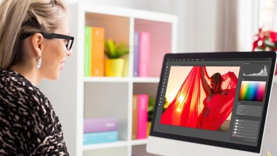 Person sat at a computer looking at photoshop