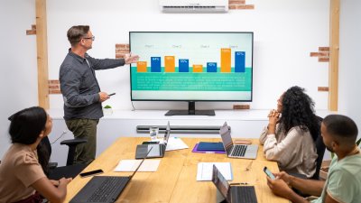 Man pointing at a powerpoint presentation
