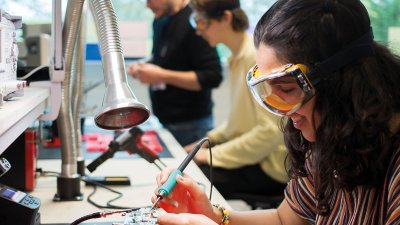 Student working on electronics in Robotics studio