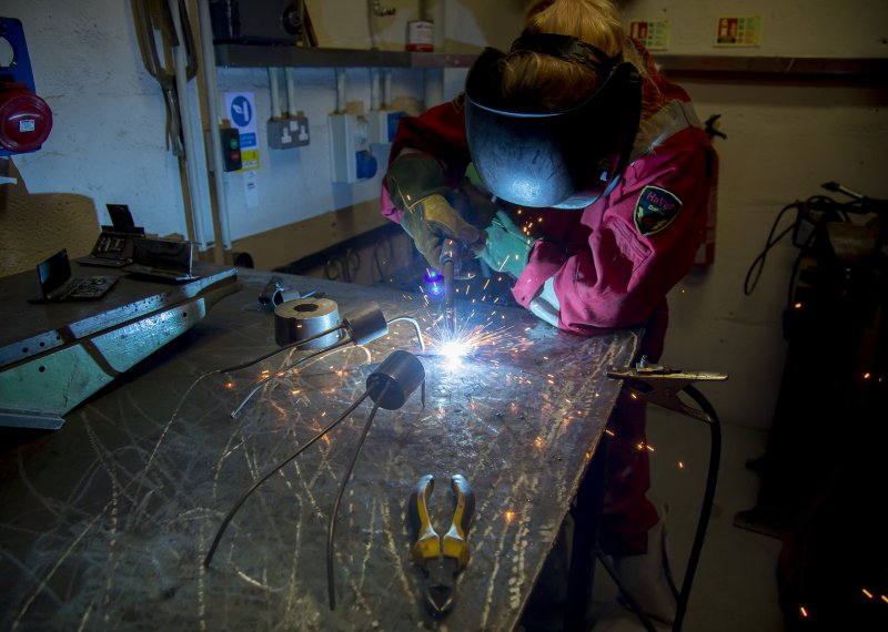 Student working in metal work studio