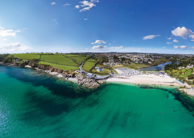 Aerial View Of Swanpool Beach with sea and cliffs