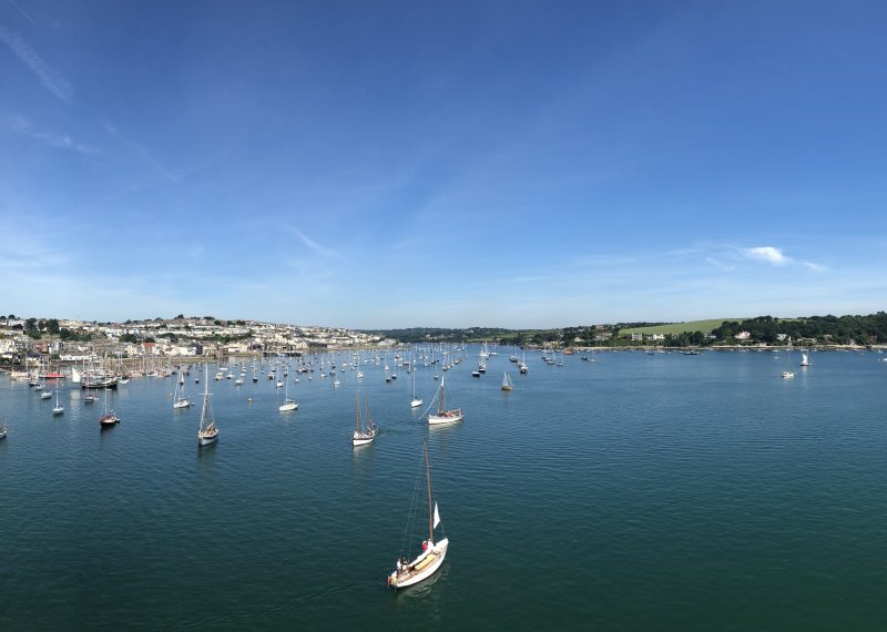 View of Falmouth from the water, coastline and boats.