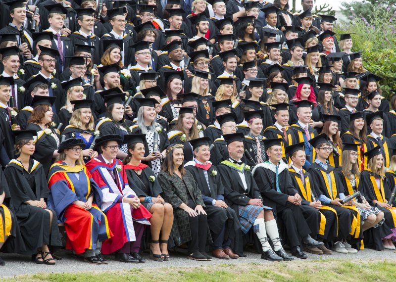 Chancellor, Dawn French, sat in the centre of the 2018 graduates having their photo taken.