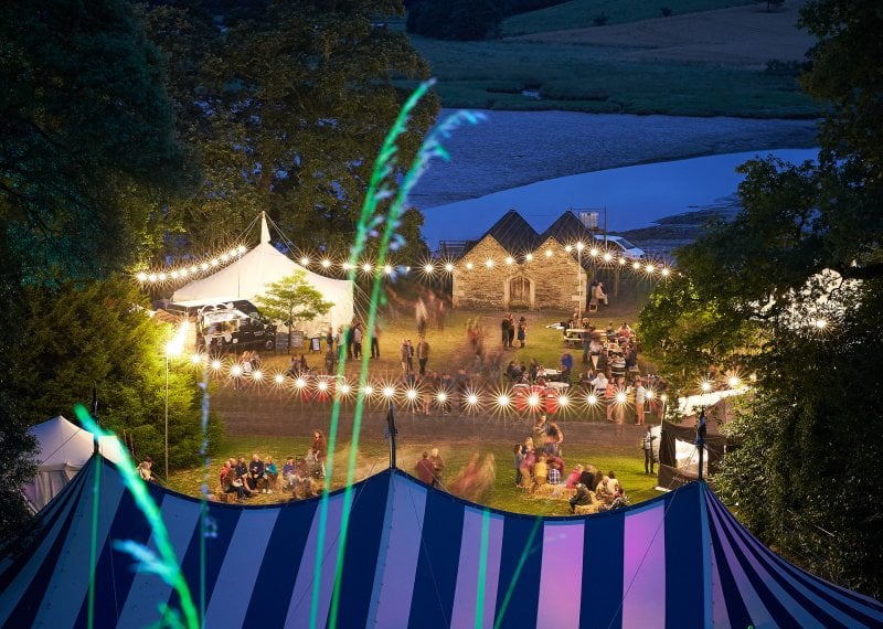 Blue and white striped Festival tent at dusk