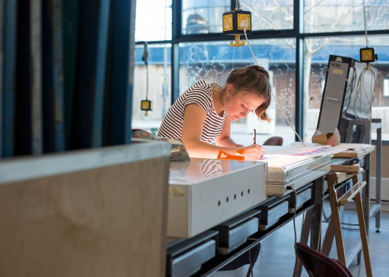 Female student working in textiles studio