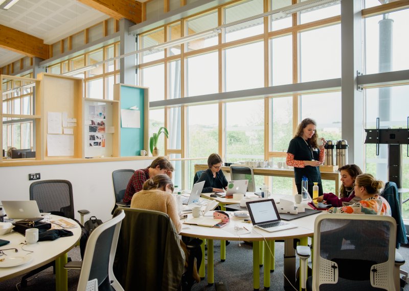 Students sat around a table in the AIR building