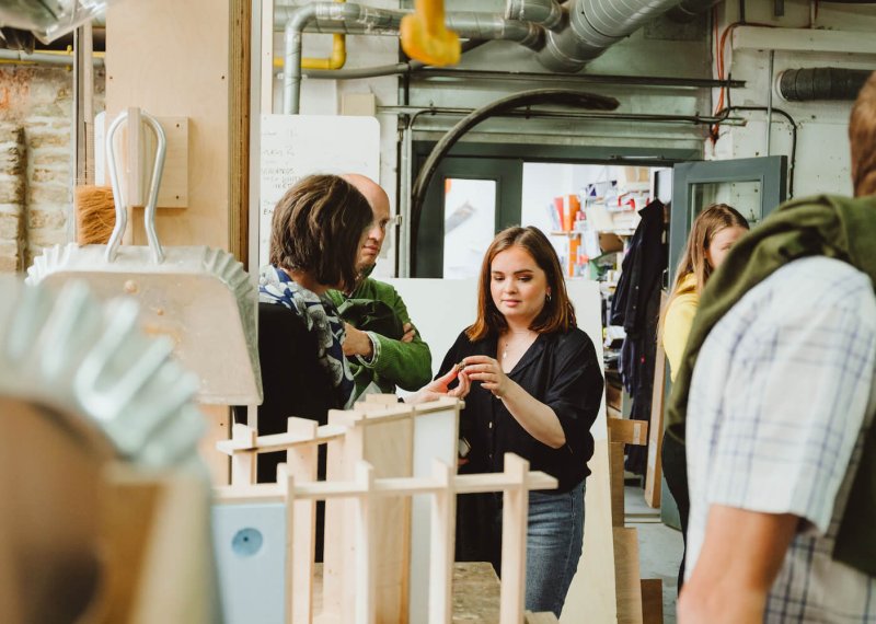 Family exploring workshop on an open day.