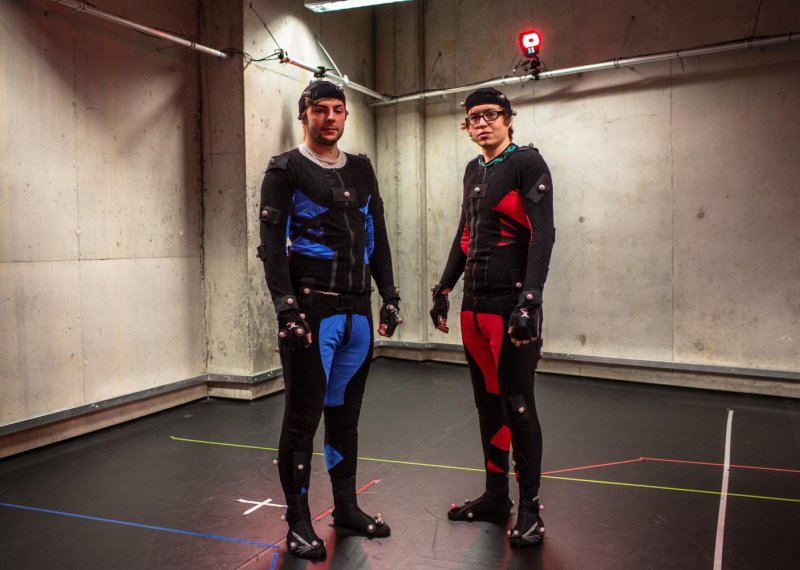 Students wearing motion capture suits.