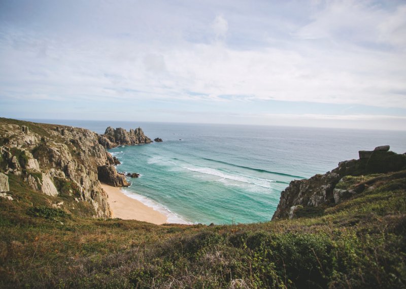 on a cliff top overlooking the beach and sea