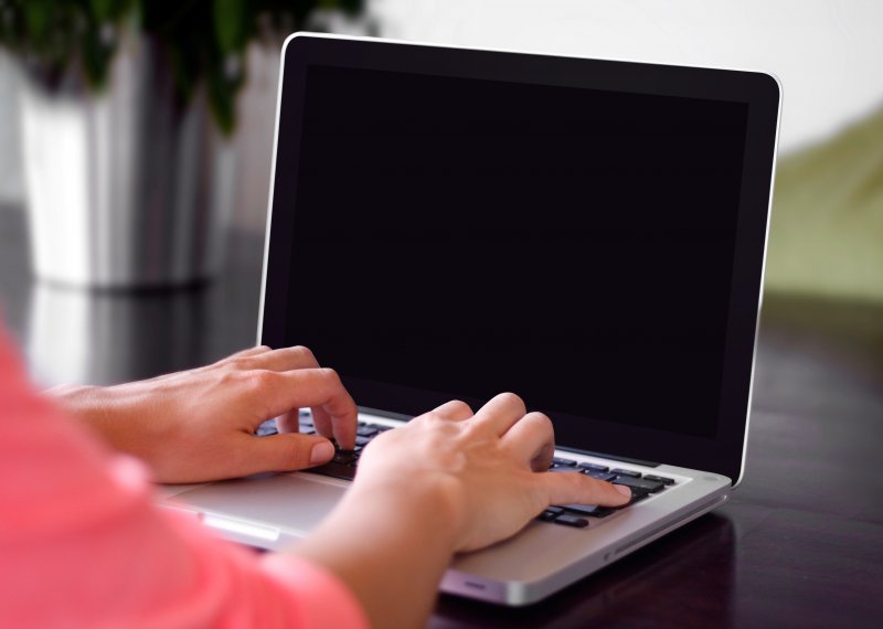 Person typing on a laptop