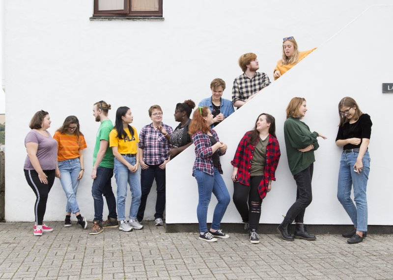 Falmouth students talking on stairs