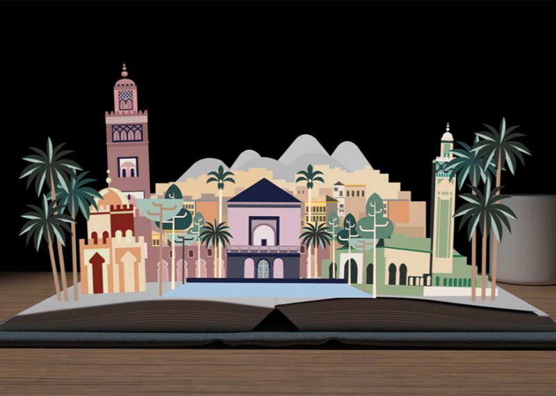 A pop up book of buildings and palm trees