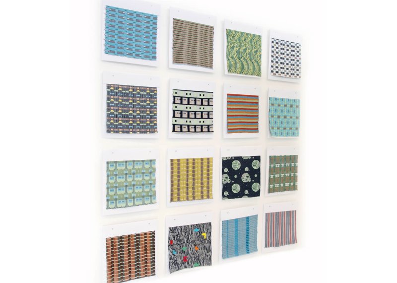 Wall display of different patterned and coloured samples.