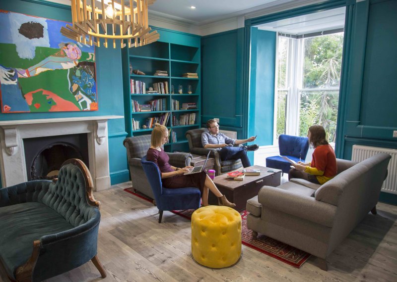 Students sitting working in the writing room