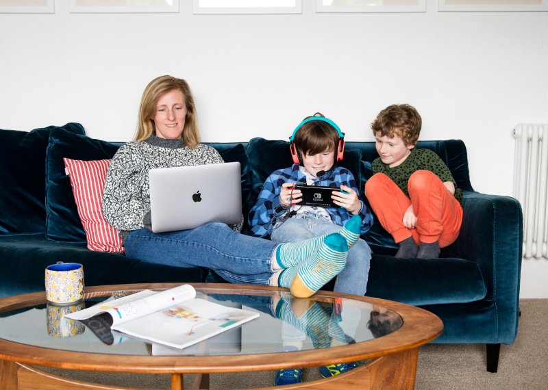A family sat on a sofa
