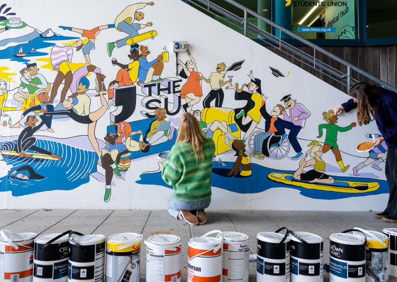 Students painting the Students' Union mural