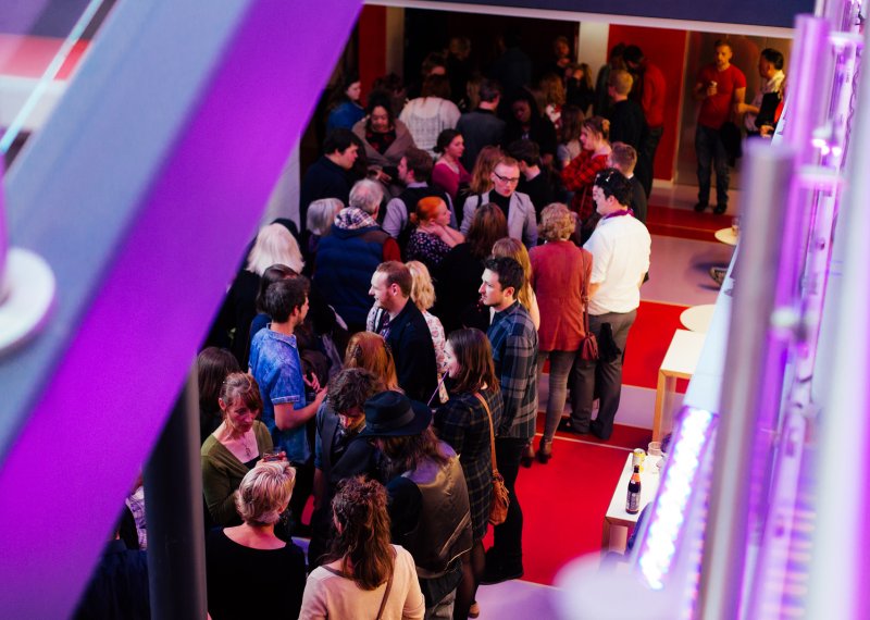 Crowd in foyer of AMATA arts centre