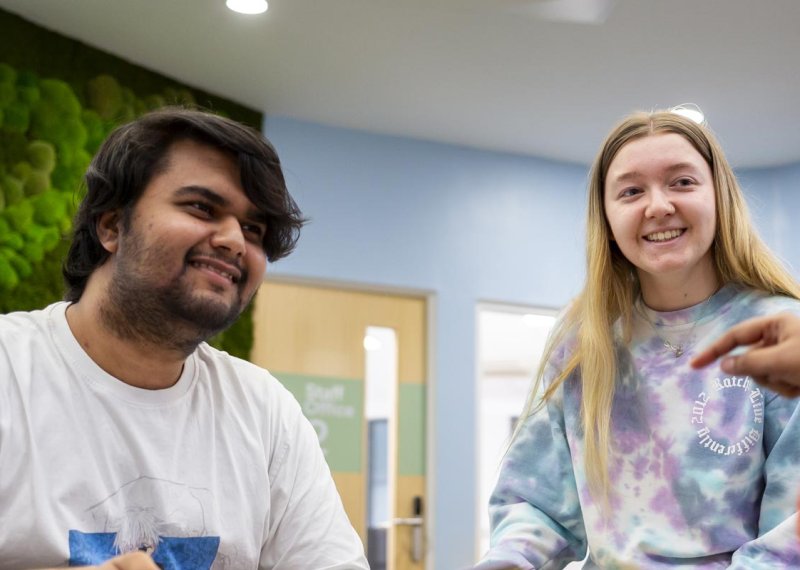 Three business students from Falmouth University in conversation