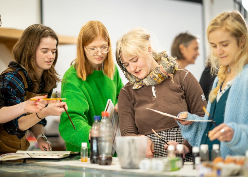 Students painting in a workshop at Falmouth Illustration Festival 