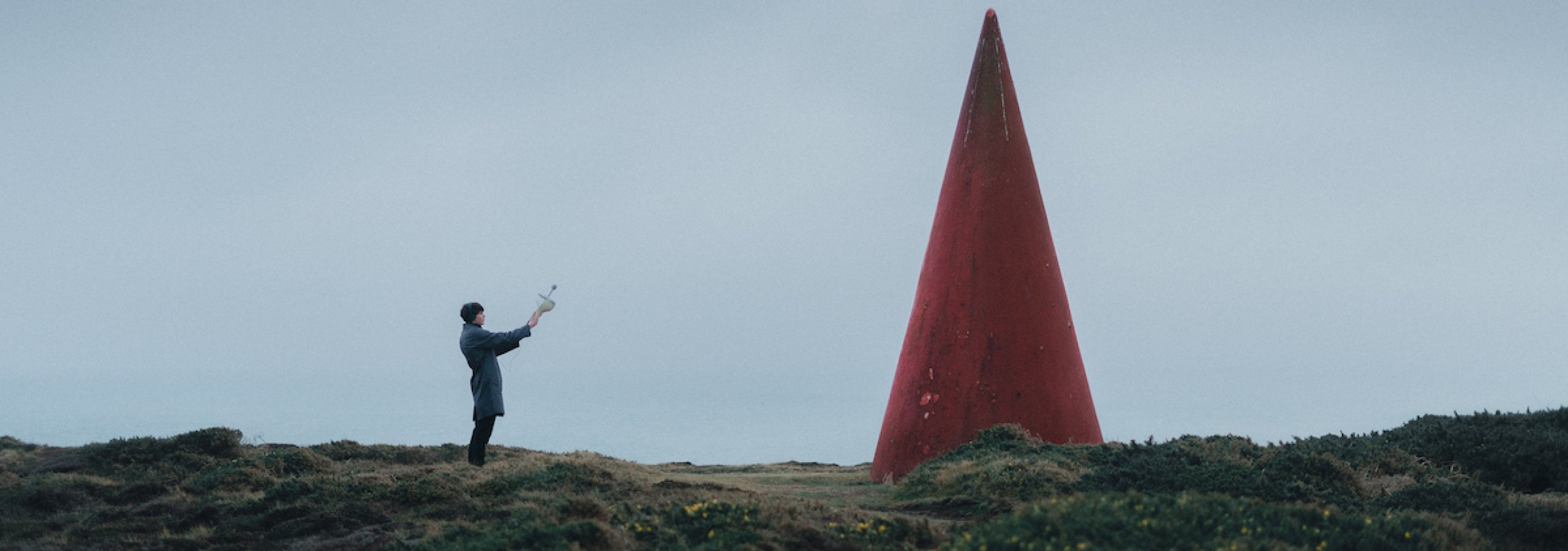 Person holding radio to the sky