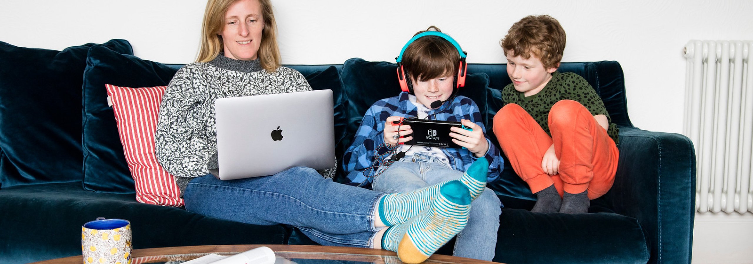 A family sat on a sofa