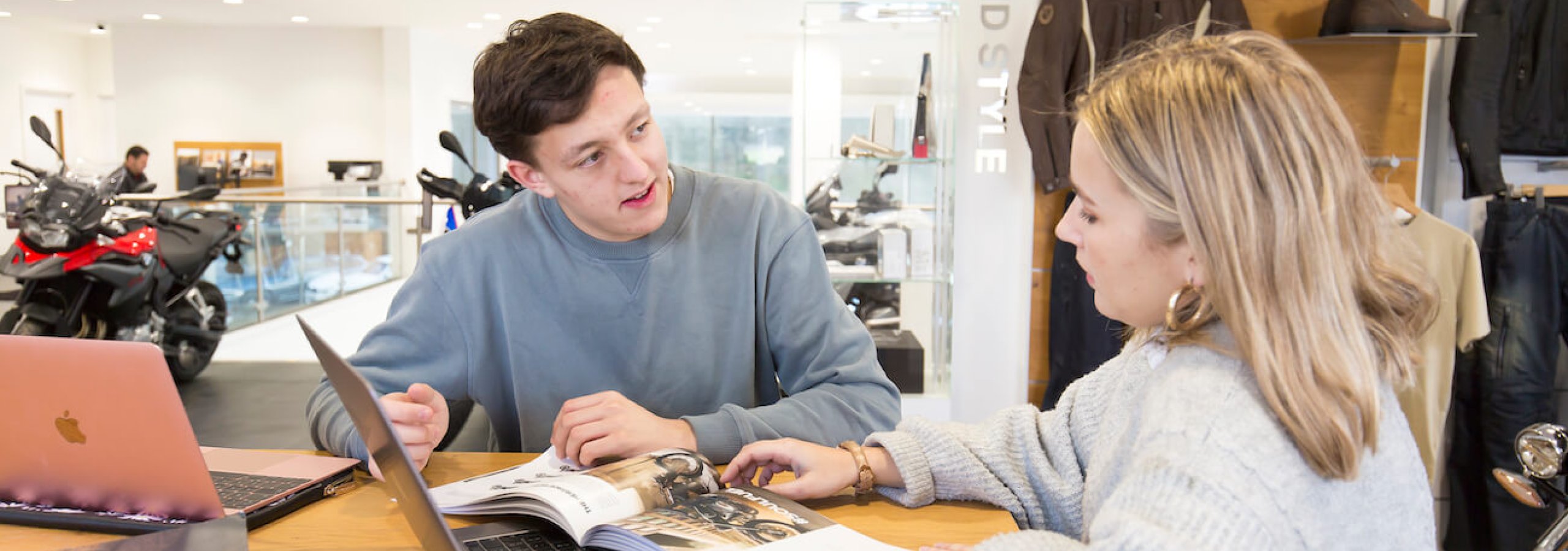 Student sitting in work placement at BMW garage