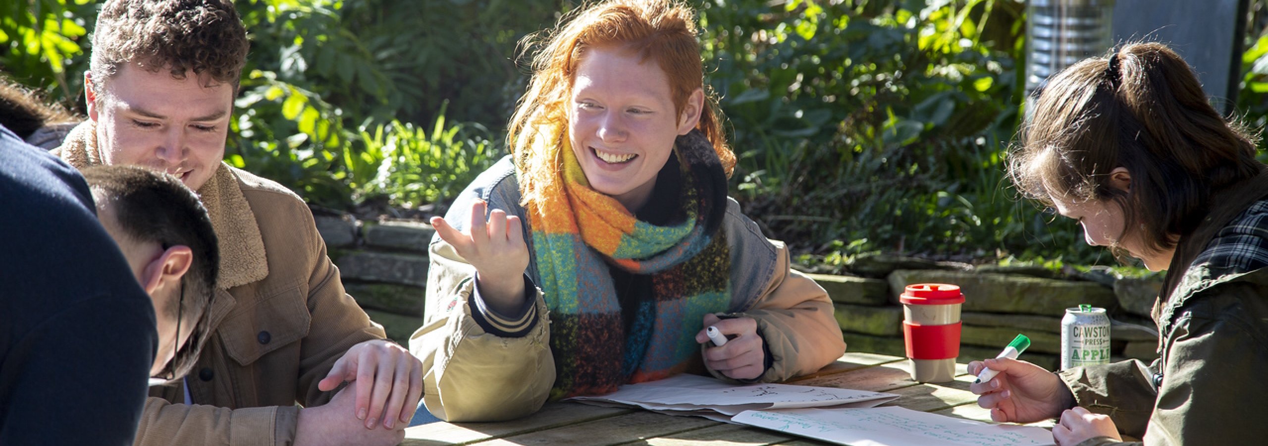 Creative Writing MA students working collaboratively outside