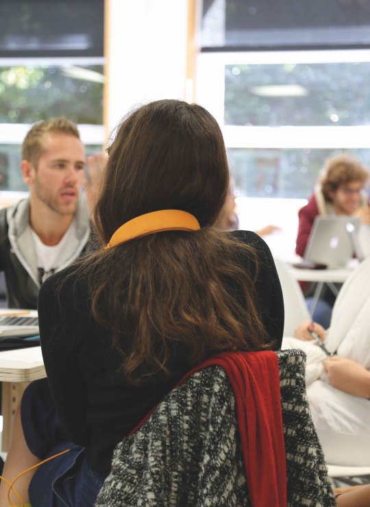 MA Graphic Design students chatting around a table