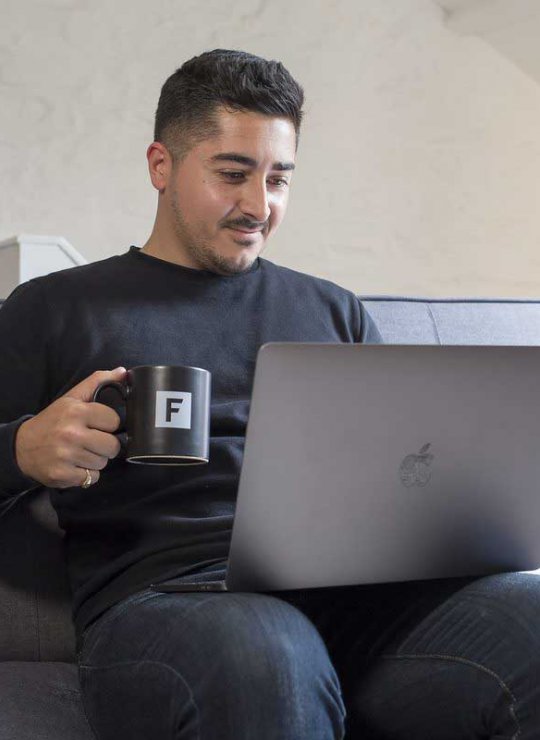 A short course student working on their laptop