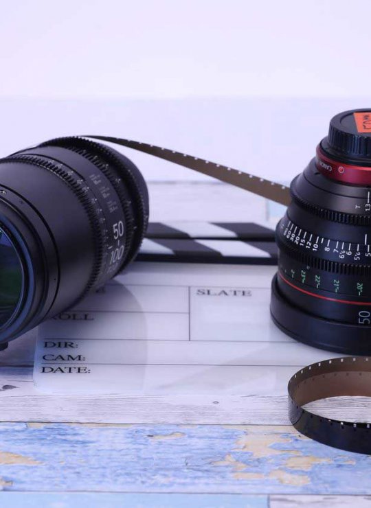 Two camera lens on a table 
