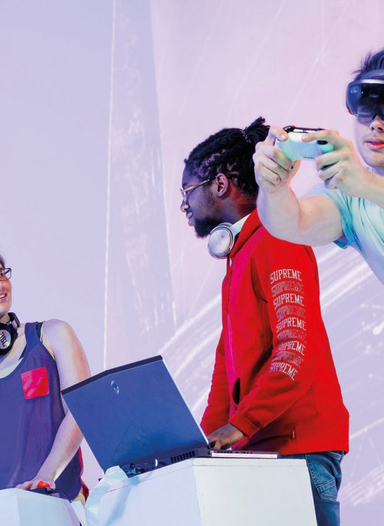 Student with VR set and hand controller