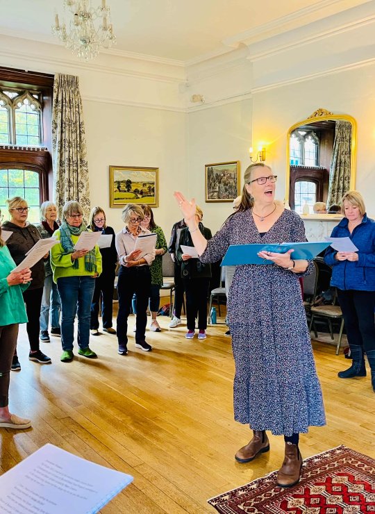 Pip Wright leading singing