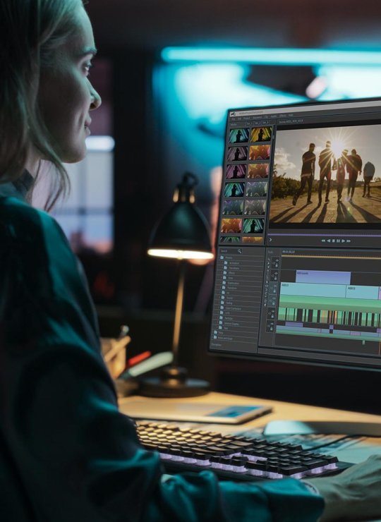A woman using video editing software