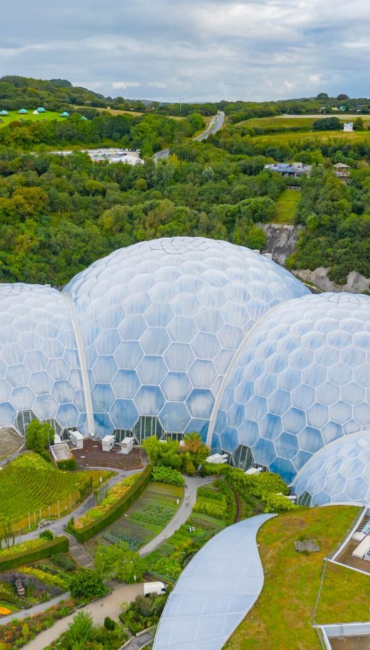 Aerial view of the Eden Project domes with fields and sky