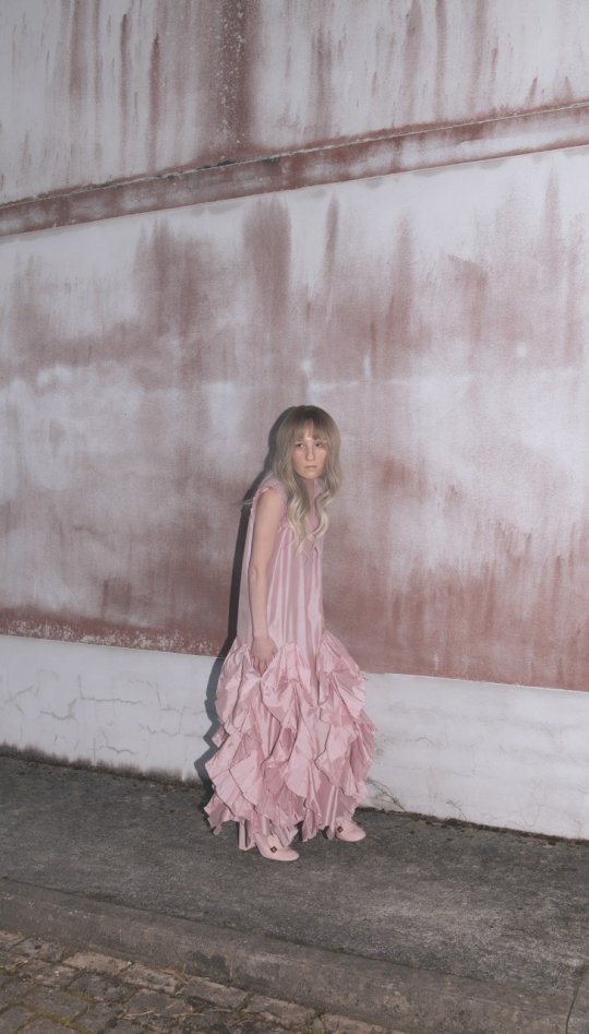 Alice Marple Horvat woman in pink dress on street